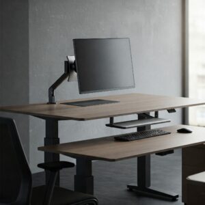 Ergonomic setup with an adjustable height executive desk, monitor arm, and keyboard tray for optimal comfort.