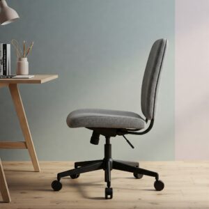 A narrow office chair suitable for smaller individuals or compact workspaces, emphasizing its reduced width.