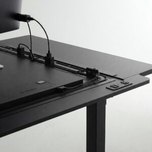 "Integrated cable management solutions on a 72 inch standing desk, keeping the workspace tidy and organized."