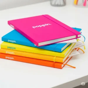 Stack of brightly colored Poppin notebooks, perfect for adding a pop of color to your poppin office supplies collection.