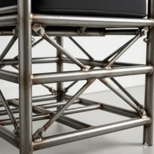 Close-up of a reinforced steel frame underneath a chair, showing the extra support designed for bariatric chairs for heavy people.
