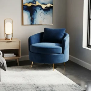 A small, round armchair upholstered in deep blue velvet, adding a touch of elegance to a modern bedroom corner.