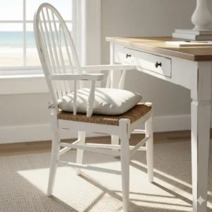 A white, ergonomic coastal desk chair with a clean, minimalist design, ideal for a bright, airy home office.
