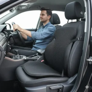 Driver comfortably sitting with the installed backrest support for car to improve driving posture.