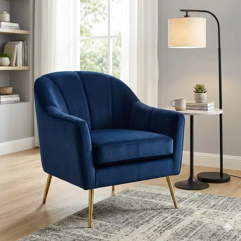 Featured Image: A luxury navy blue velvet accent armchair with gold legs styled in a modern living room.