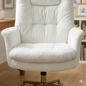 Close-up of the lumbar support and thick cushioning on an ergonomic plush desk chair.