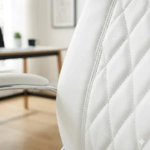 Close-up shot showing the premium stitching and texture of the white leather office chair upholstery.