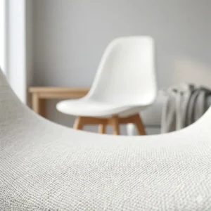 Minimalist Scandinavian style white chair featuring clean lines and a functional design.